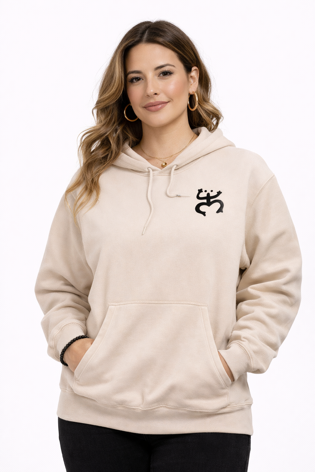 Woman wearing a beige hoodie with a coqui logo design on a white background
